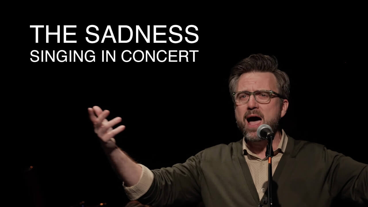 The Sadness—Singing in Concert